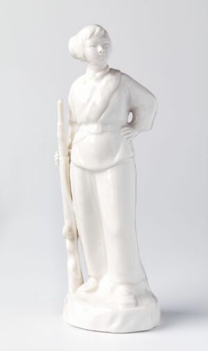  A white porcelain figurine of a person in historical European attire, standing with one foot forward and holding an object next to the right side of the body, set against a light grey background.