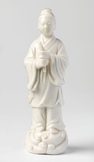  Porcelain figure of Han Xiangzi, an unknown artist's representation of a Chinese mythological figure, standing serenely in traditional attire with delicate folds, holding an item close to his chest atop a cloud-like base, rendered in a luminous white glaze.