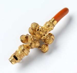  An ornate, golden ceremonial key with an intricate filigree design and a polished amber-colored handle against a neutral background. Artistname and title are unknown.