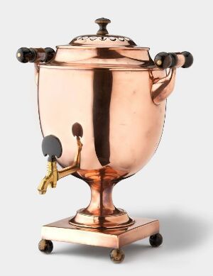  A polished copper samovar with black handles and a brass spigot, resting on a square base, against a light background. Artistname and title are unknown.