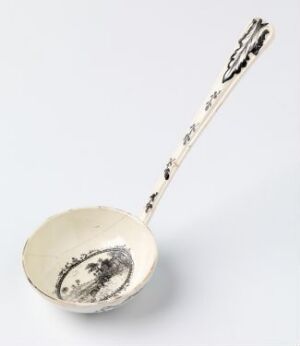  An antique silver spoon with intricate designs on the handle and an etched illustration in the bowl, placed on a light grey background.