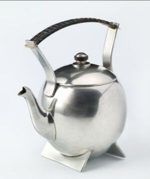  A silver teapot with a rounded body, reflective surface, and a curved spout, featuring a contrasting black handle and sitting on a white background.