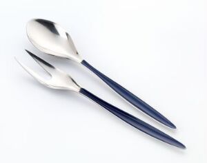  "Cathedral" by Cathrineholm, featuring a stainless steel spoon and fork with handles that transition from metallic silver to deep blue, exemplifying the design/kunsthåndverk classification, set against a pale background.