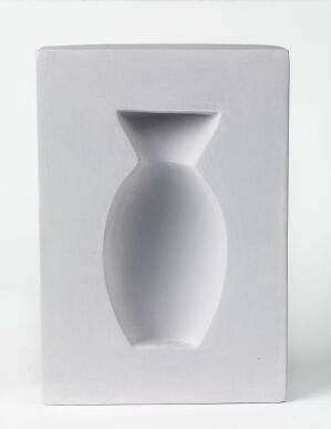  "Optica" by Elisabeth von Krogh, a decorative object made of modeled earthenware with begitning, featuring a white rectangular base with a three-dimensional impression of a vase in the center, playing with light and shadow to create an optical illusion.