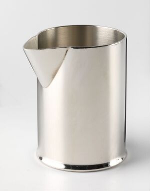  A sleek, silver-metal cylindrical object with a spout on one side, reflecting shades of grey on its smooth, polished surface, against a plain light background.