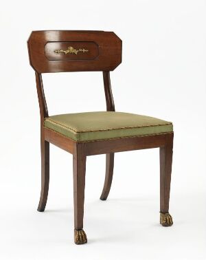  A classical wooden chair with lion paw carvings on the front legs, upholstered with olive green and muted gold striped fabric.