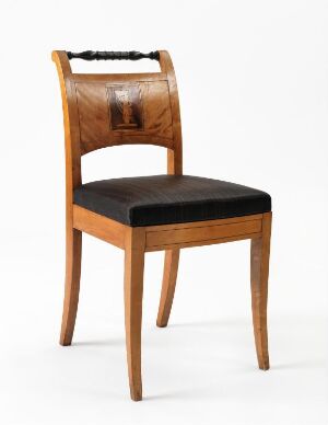  An elegant wooden chair with a curved backrest and black upholstered seat, set against a light-colored background, highlighting the chair's warm brown tones and simple design.