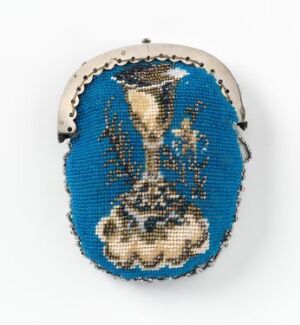  A small, oval-shaped beaded purse, displaying a cobalt blue background with an intricately beaded flower vase and floral design, finished with a metal framed clasp at the top.