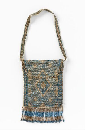  A beaded shoulder bag featuring geometric patterns in shades of blue, gold, and white, with a fringed bottom edge and a beaded strap.