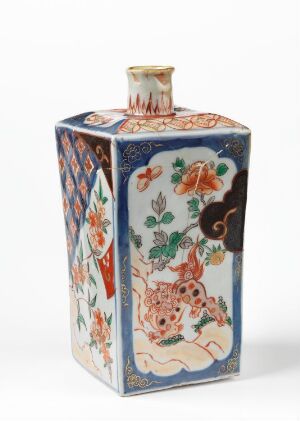  An ornate rectangular ceramic flask with a flat body and a flared neck, intricately decorated with floral designs and geometric patterns in vibrant shades of blue, orange, green, and red on a white background.