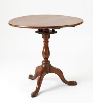  Traditional round wooden table with a central pedestal and tripod base with clawed feet, finished in a warm, medium brown tone with red undertones.