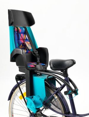  "Discovery 103" child bicycle seat by Hamax Norge A/S, mounted on the rear carrier of a navy blue adult bicycle. The seat is made of bright turquoise plastic with black padding, a harness system with purple accents, and footrests with safety straps.