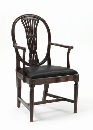  A classic "Armstol" chair by an unidentified artist, with a dark stained beech and pine structure, horsehair upholstered seat, oval backrest with vertical spindles, and sturdy armrests.