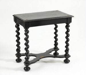  A small black table with a rectangular flat top and intricately spiraled legs connected by a curved stretcher at the bottom, set against a neutral background.