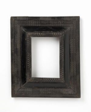  An empty, rectangular, dark-colored frame with textured patterns and layers, suggestive of fine, ornate craftsmanship, displayed against a neutral background.