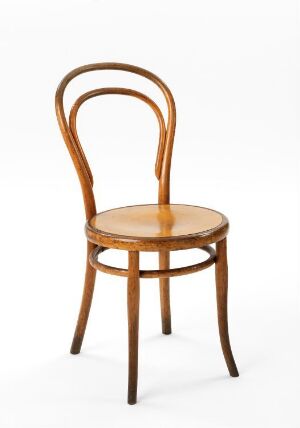  A varnished and stained beech and birch wood chair designed by Michael Thonet, featuring a curved loop backrest, a circular seat, and four curved legs with rounded cross beams for support, set against a white background.