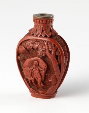  A reddish-brown stone snuff bottle with intricate relief carving of a person by a tall plant or tree, bordered by decorative leaf-like patterns, capped with a small flat lid.