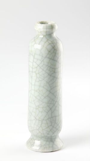  A slender porcelain vase with a soft white glaze and a delicate crackle pattern set against a light background.