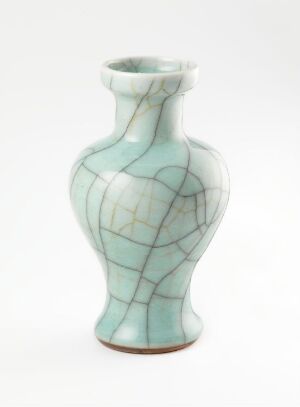  A slender porcelain vase with a bulbous center features a pale celadon glaze with intricate crazing patterns over its surface, set against a white background.