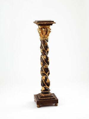  An ornamental pedestal with a twisted column design, featuring gold leaf details on a dark twisting background, supported by a square base and topped with a flat platform, set against a light gray background. Artistname and title unknown.