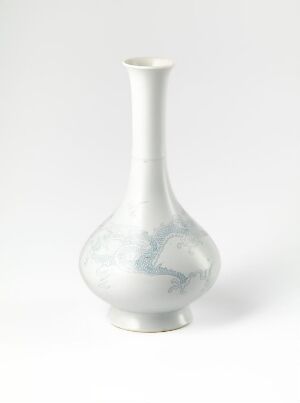  A slim, white porcelain vase with a subtle blue floral design on its bulbous lower half, displayed against a white background.