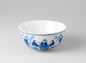  A traditional blue and white porcelain bowl with painted figures and foliage in blue on a white background, exemplifying classic Asian ceramic artistry.