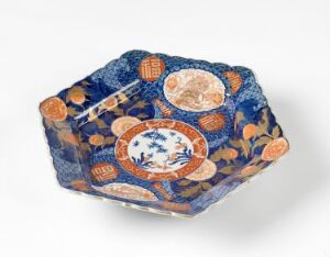  An intricately designed hexagonal box with decor in cobalt blue, orange, and white hues, adorned with detailed medallions and gold accents, artist and title unknown.