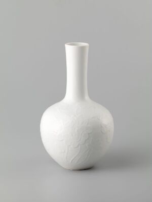  An elegant white vase with a rounded body and narrow neck displayed against a light grey background, showcasing its simplicity and smooth texture. Artist name and title are unknown.