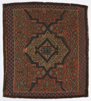  A square-shaped textile with intricate geometric patterns, featuring a central octagonal design surrounded by various borders in shades of burnt orange, dark blue, greens, brown, and light blue. Artistname and title are unknown.