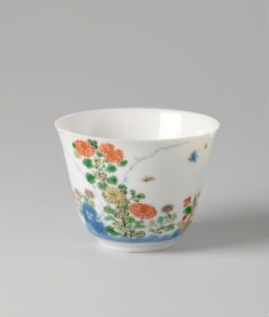  A decorative porcelain cup with a tapered shape, featuring a hand-painted floral design in orange, peach, and yellow with green leaves, and a rich blue base on a white background. Artist and title are unknown.