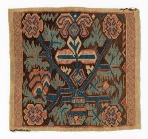  An antique tapestry or rug with a symmetrical geometric and stylized floral pattern in muted teal, indigo blue, rust orange, beige, and brown tones, displaying intricate designs and worn edges. Artistname and title unknown.