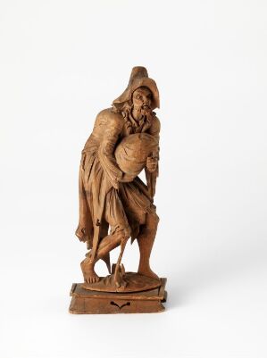  A detailed wooden sculpture of an elderly, bearded man in a draped cloak with a contemplative expression, set against a plain white background.