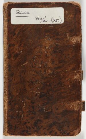  An aged leather-bound sketchbook titled "Skissebok," showing signs of wear with a texturized dark brown cover and loose straps at the bottom, and a label with cursive handwriting at the top.