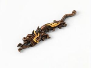  A detailed, stylized dragon figurine with a dark brown and dark gold color scheme, featuring intricate scales and regal adornments, displayed against a plain off-white background.