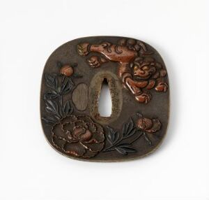  Intricate dark brown tsuba with a central elliptical opening, carved with a lion-like mythical creature and floral patterns, exhibiting a reflective surface with shadows that emphasize its detailed craftsmanship.