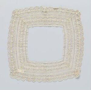  An ornate square fabric frame with intricate lace or embroidery designs in soft white, set against a light gray background. The frame curves outward at each corner and features detailed scrollwork, giving it a classical, handcrafted look.