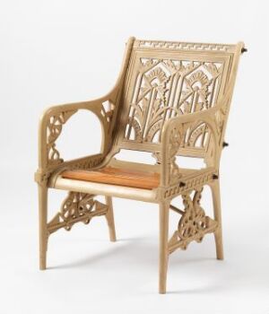  A 'Stol' chair designed by Christopher Dresser, featuring color lacquered cast iron with intricate patterns and an oak seat.