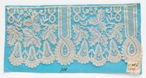  Intricate white lace with a floral and teardrop pattern on a blue background. Artist name and title are unknown.