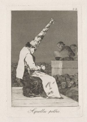  Monochrome etching by Francisco de Goya, titled "Those specks of dust," showing a person seated and wearing a cone-shaped hat covered with dark specks, surrounded by faintly sketched faces in the background.