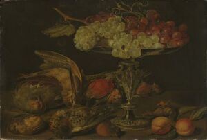  "Still Life with Silver Vase" by an unidentified Flemish artist, an oil on wood painting featuring a dark-hued composition with a gently illuminated silver vase, surrounded by richly colored fruits such as grapes, peaches and pears, with a loaf of bread on a wooden table, suggesting affluence and abundance in a classic still life arrangement.