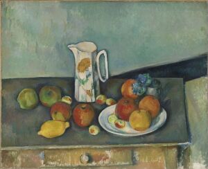  A still life painting by Paul Cézanne featuring a white pitcher with floral patterns and a plate of brightly colored fruits, including apples and a lemon, set against a muted background of pale blues and greys, with a dark green to black tablecloth in the foreground.