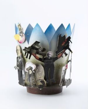  "Bursdagskrone II" - A whimsical, artistic crown by Elsie-Ann Hochlin, made of aluminum with jagged projections and adorned with a black and white photographic collage. The crown is suggestive of a celebratory or theatrical theme with its dynamic figures and varied textures.