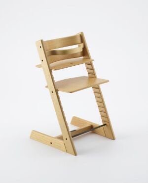  Scale model of the Tripp Trapp highchair by Peter Opsvik crafted from lacquered and bent beech wood, featuring adjustable seat and footrest, displayed against a neutral background.