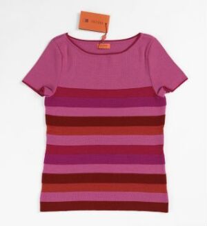  A short-sleeve t-shirt designed by Solveig Hisdal, featuring horizontal stripes in various shades of pink and purple. The t-shirt is made of 75% merino wool and 25% silk, laying flat against a light background with a branded tag visible at the neck.