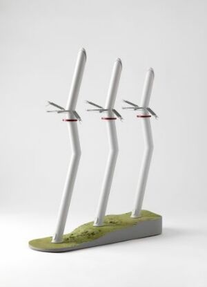  A scale model titled "Lysebotn, Power in balance" by Widenoja Design, featuring three slender white wind turbines with red and black-tipped blades on a green textured base representing a landscape. The design, made from MDF, plastic, and metal, showcases a modern and environmentally conscious industrial design.