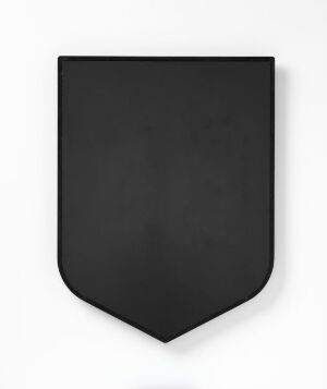  A minimalistic, matte black shield-shaped object against a white background, with a modern design and no visible markings or textures. Artist name and title are unknown.