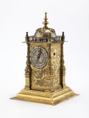  An ornate, golden antique clock with intricate designs and a dome top, featuring a Roman numeral clock face and an elaborate columned gallery, standing on a square base.