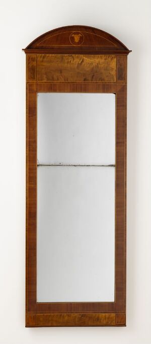  A tall, arched-top console mirror titled "Konsollspeil", made of lacquered mahogany veneer on pine with flame birch and boxwood marquetry, by an unidentified producer. The mirror's rich, dark wooden tones contrast with lighter marquetry patterns, embodying a classic and refined design.