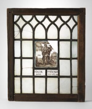  A stained glass window titled 'Fides' by an unknown artist, featuring a wooden frame with a central sepia-tone illustration depicting a robed figure with a staff and smaller figure, surrounded by translucent light glass panels in a Gothic lattice pattern.