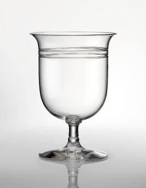  A clear glass goblet with a broad, curved bowl and a sturdy stem resting on a flat base, against a white background.